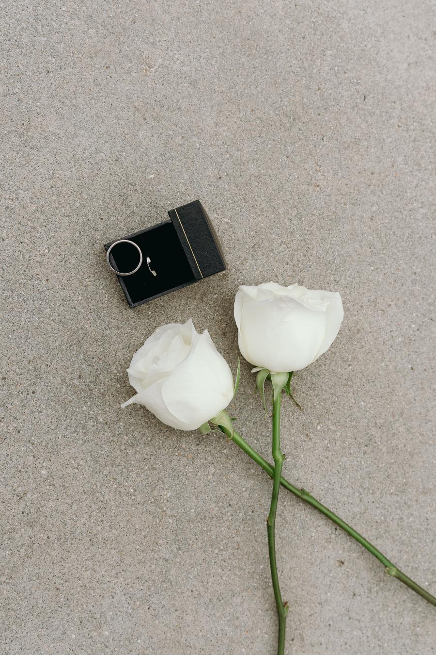 White roses and wedding rings