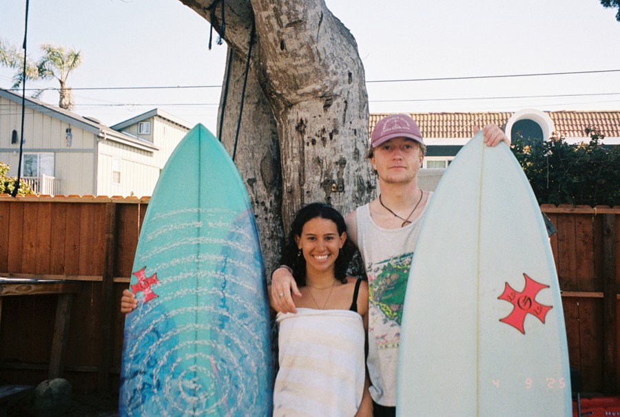 Valentina and JP with their surfboards